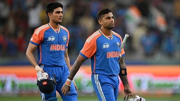 India's captain Suryakumar Yadav (R) walks along with his teammate Shubman Gill
