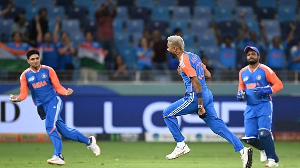 India's Hardik Pandya (C) celebrates with Shubman Gill (L) after taking the wicket of Pakistan's Saim Ayub d