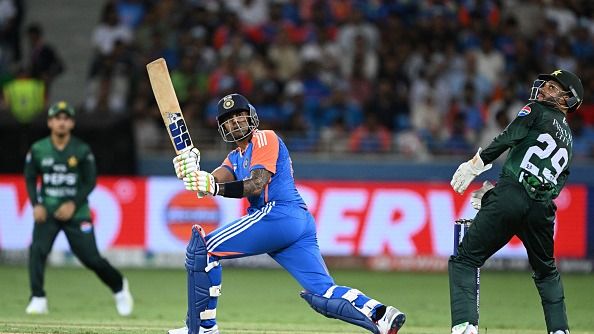 India's captain Suryakumar Yadav (C) plays a shot during the Asia Cup 2025 