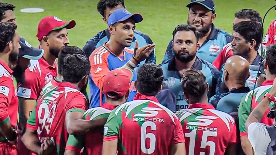 India captain Suryakumar Yadav with Oman players