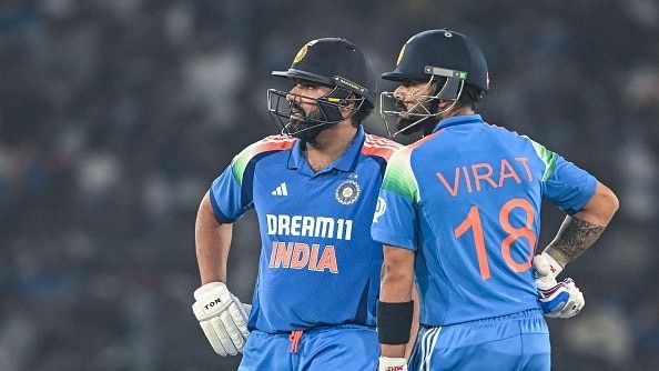 India's Virat Kohli (R) along with his captain Rohit Sharma