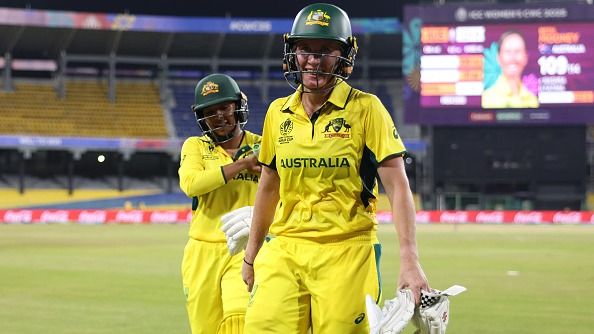 Beth Mooney smiles as she walks off with team mate Alana King