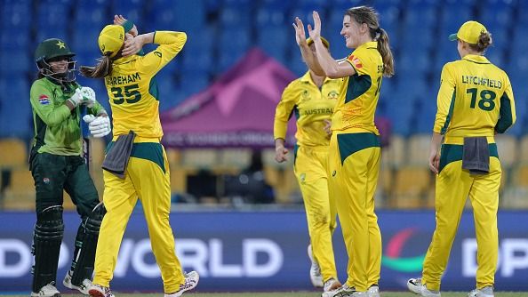 Annabel Sutherland congratulated by team mate Georgia Wareham after taking the wicket of Rameem Shamim