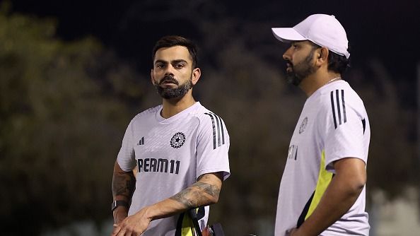 Virat Kohli of India speaks to Rohit Sharma