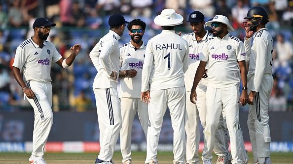 India's Ravindra Jadeja (3L) celebrates with teammates after taking the wicket of West Indies' Tagenarine Chanderpaul