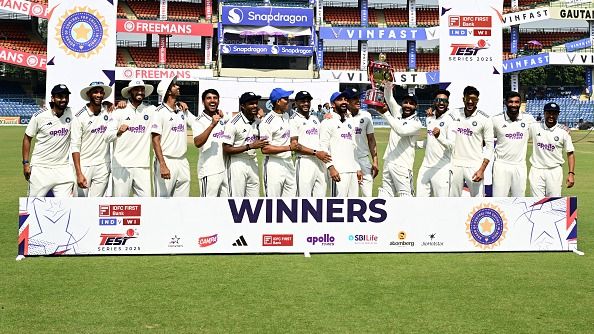 India's players celebrate with the trophy