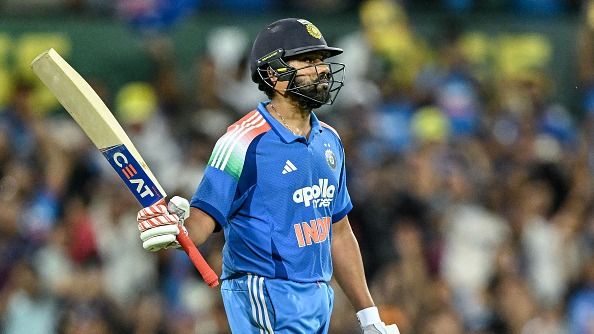 India's Rohit Sharma reacts after scoring a century (100 runs) during the third one-day international