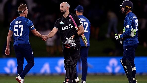 Luke Wood of England shakes hands with Daryl Mitchell