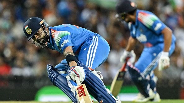 India's Virat Kohli (L) and Rohit Sharma run between the wickets