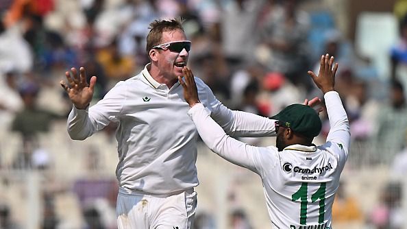 Simon Harmer of South Africa celebrates the wicket of Dhruv Jurel of India with teammates