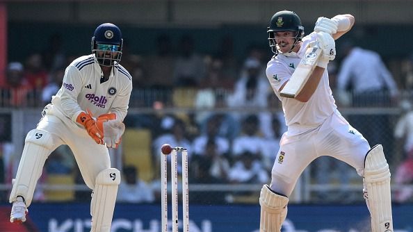 South Africa's Tristan Stubbs (R) plays a shot