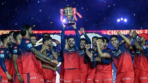 Royal Challengers Bengaluru's Virat Kohli, along with his teammates, celebrates with the trophy after winning the Indian Premier League (IPL) Twenty20 final Royal Challengers Bengaluru's Virat Kohli, along with his teammates, celebrates with the trophy after winning the Indian Premier League (IPL) Twenty20 final