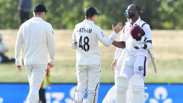 West Indies' Kemar Roach (R) shakes hands with the New Zealand West Indies' Kemar Roach (R) shakes hands with the New Zealand