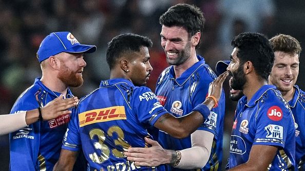 Mumbai Indians' captain Hardik Pandya (2L) celebrates with teammates Mumbai Indians' captain Hardik Pandya (2L) celebrates with teammates
