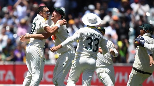 Scott Boland and Cameron Green celebrate the dismissal of Josh Tongue
