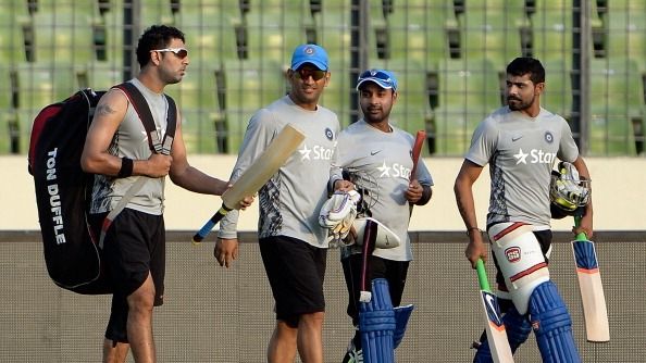 Indian players (L-R) Yuvraj Singh, captain Mahendra Singh Dhoni, Amit Mishra and Ravindra Jadeja walk back from the nets