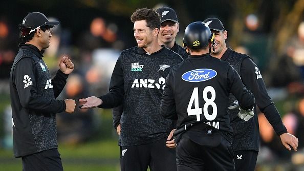 New Zealand's Mitchell Santner (2nd L) celebrates with his teammates