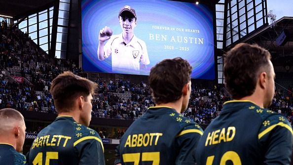 Players observe a minute's silence for young cricketer Ben Austin