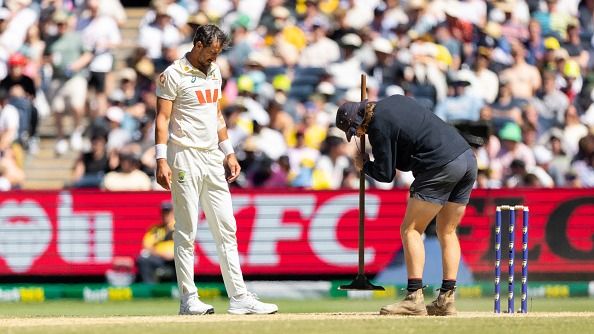 Starc is seen getting some pitch work done during day two of the Fourth Test Match