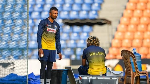 Sri Lanka's bowling strategic coach Lasith Malinga (R) speaks with captain Dasun Shanaka