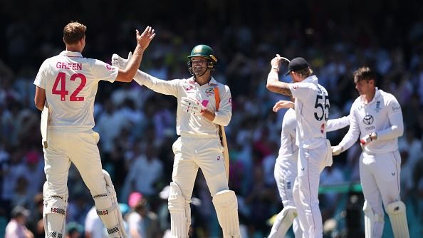 Alex Carey of Australia celebrates winning the test with Cameron Green of Australia