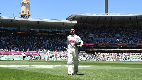 Usman Khawaja of Australia leaves the field after being dismissed