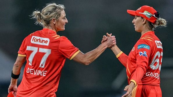 Gujarat Giants' captain Ashleigh Gardner (R) and her teammate Sophie Devine celebrate