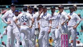 England's captain Ben Stokes (C) reacts with teammates as they watch a replay England's captain Ben Stokes (C) reacts with teammates as they watch a replay