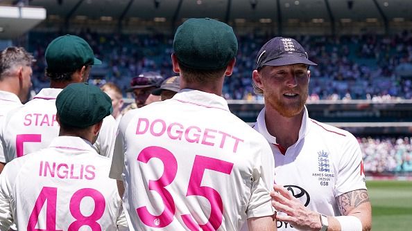 England's Ben Stokes shakes hands with Australia's Brendan Doggett
