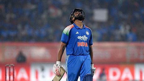 India's Rohit Sharma walks back to the pavilion