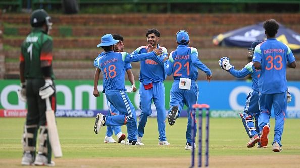 Vihaan Malhotra of India celebrates the wicket of Kalam Siddiki Aleenof Bangladesh