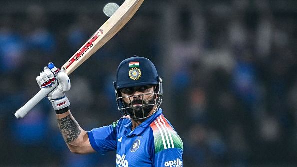 India's Virat Kohli celebrates after scoring a century (100 runs)