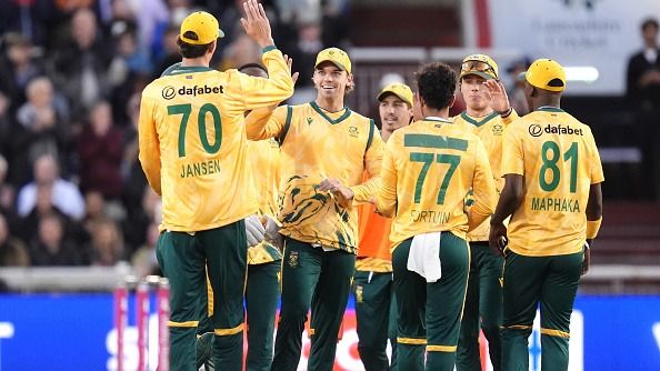 South Africa's Tristan Stubbs (centre, facing) celebrates after catching out England's Jos Buttler