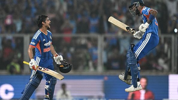 India's Ishan Kishan (L) celebrates with Hardik Pandya