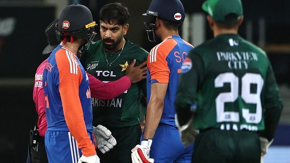 Pakistan's Haris Rauf (3R) speaks with India's Abhishek Sharma
