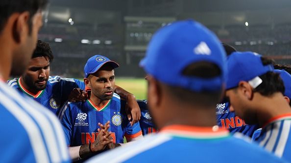 Suryakuma Yadav of India speaks to teammates during a warm up match