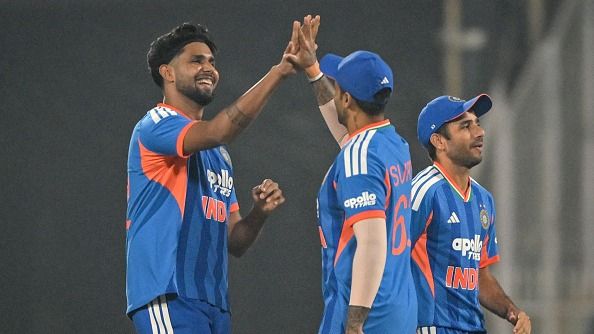 India's Harshit Rana (L) celebrates with teammates