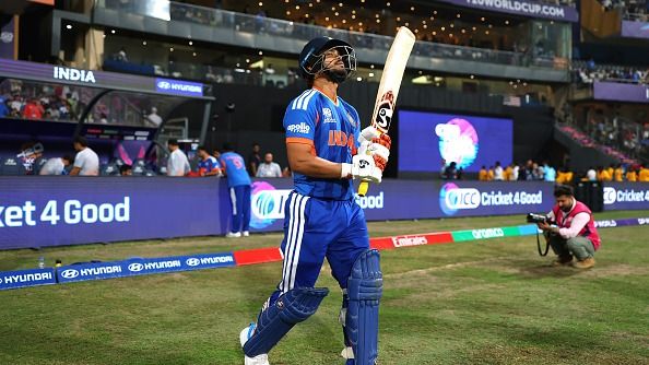 Ishan Kishan of India walks out to bat