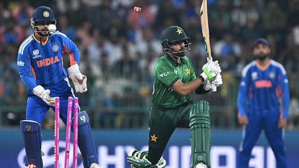 Pakistan's Babar Azam is clean bowled by India's Axar Patel