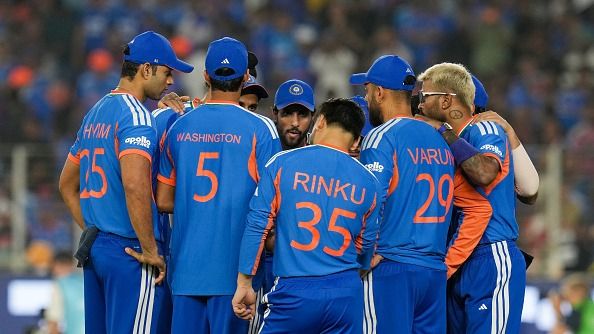 Indian players in a huddle 