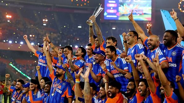 Suryakumar Yadav of India lifts the trophy