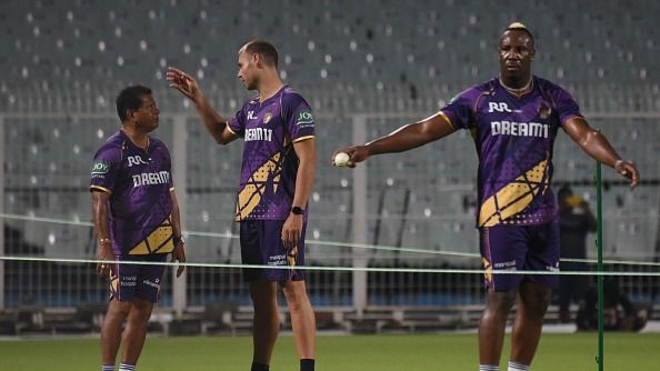 handrakant Pandit, the head coach of KKR, is with KKR's Spencer Johnson and Andre Russell at the training session ahead of the Indian Premier League (IPL) 2025 