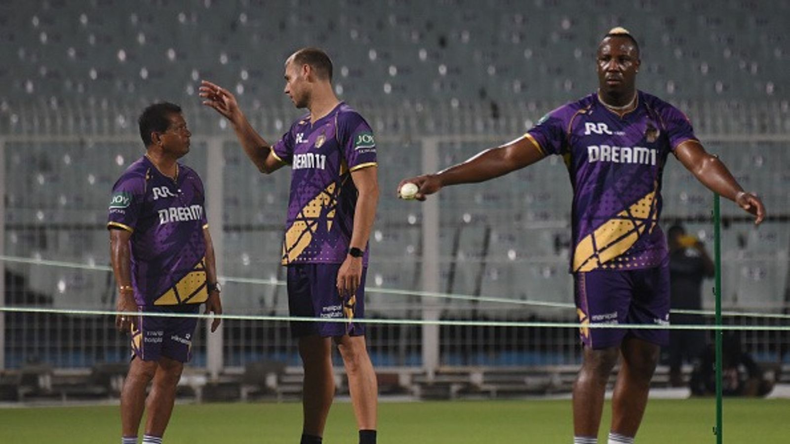 कोलकाता नाइट राइडर्स ने IPL 2026 के लिए लॉन्च की जर्सी, इस अंदाज में दिखेगी शाहरुख खान की टीम handrakant Pandit, the head coach of KKR, is with KKR's Spencer Johnson and Andre Russell at the training session ahead of the Indian Premier League (IPL) 2025