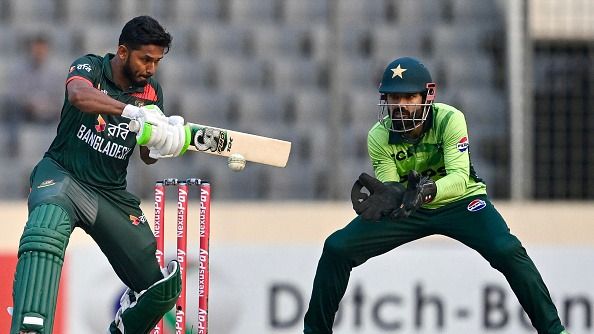Bangladesh's Tanzid Hasan Tamim (L) plays a shot