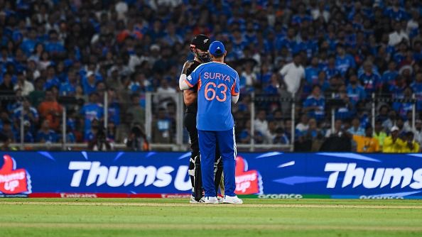 Daryl Mitchell talks to India's captain Suryakumar Yadav