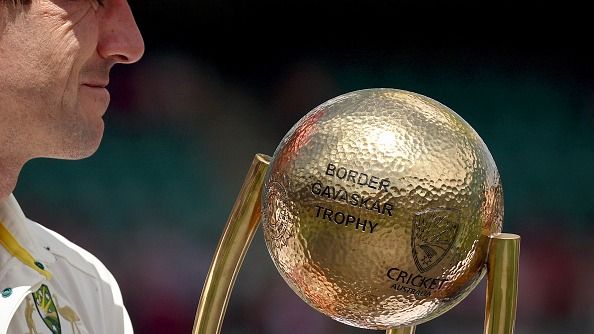 Australia's captain Pat Cummins holds The Border-Gavaskar Trophy