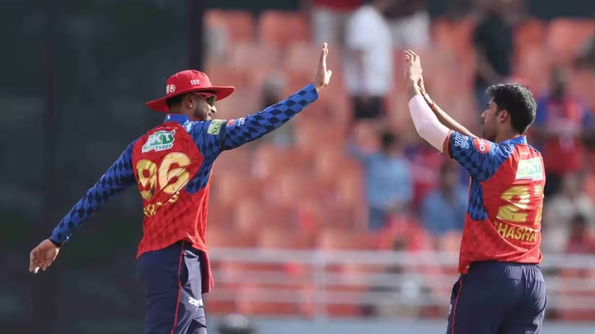 Shashank Singh celebrates with captain Shreyas Iyer after taking a wicket.
