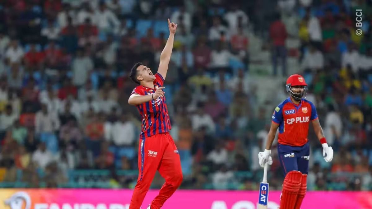 Arjun Tendulkar after taking a wicket