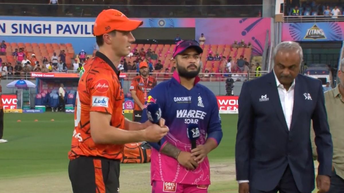 Pat Cummins and Riyan Parag during the toss.