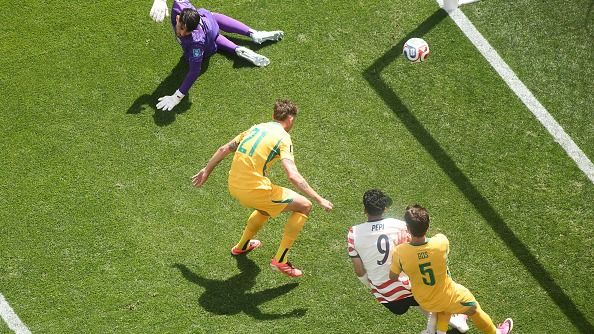 Cameron Burgess of Australia scores an own goal